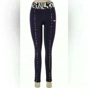 Nike Active pants size L in purple and green.